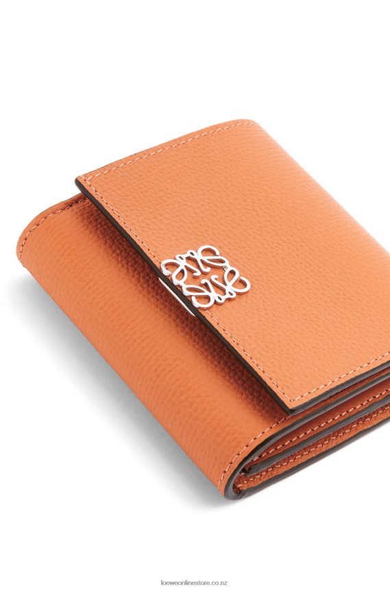 Loewe Women Anagram compact flap wallet in pebble grain calfskin Coral Reef LH60R1307